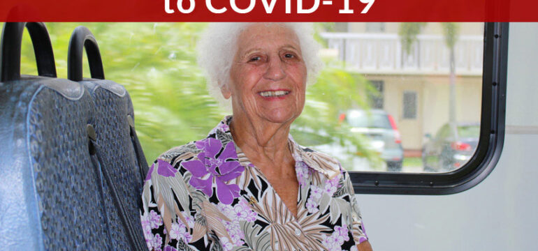 Suspended due to COVID-19, elderly woman in a bus smiling at the camera