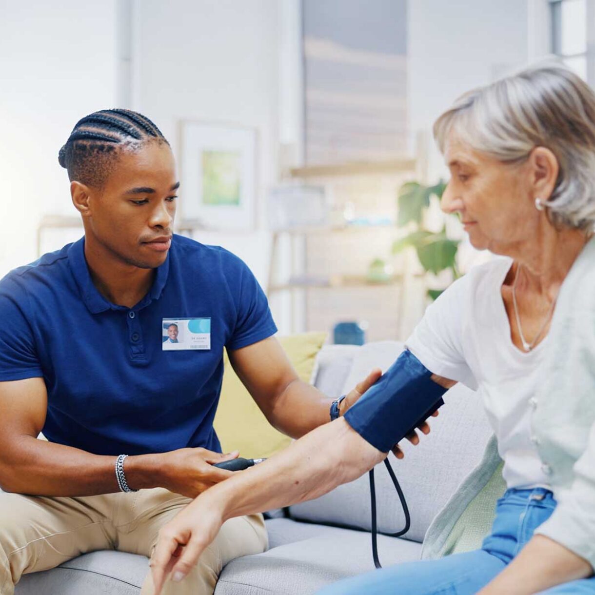 Caregiver, black man or old woman with blood pressure test consu